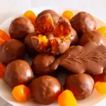 Candies with dried apricots in white chocolate